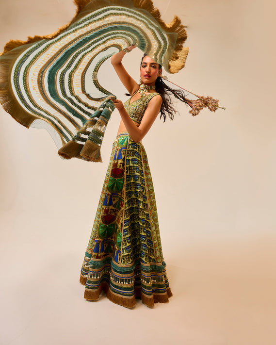 Printed embroidered green dress with brown background