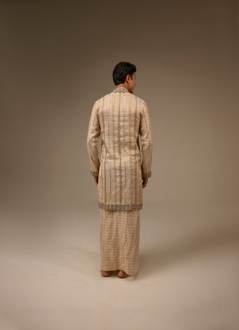 Person wearing a traditional outfit with a plain background