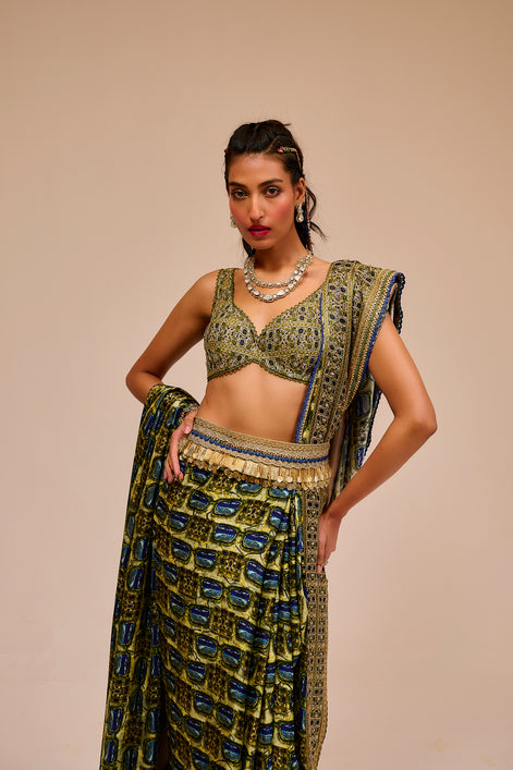 Woman wearing a traditional outfit with a patterned top and skirt on a beige background