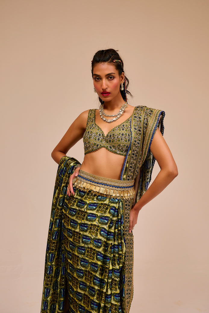 Woman wearing a traditional outfit with a patterned top and skirt on a beige background