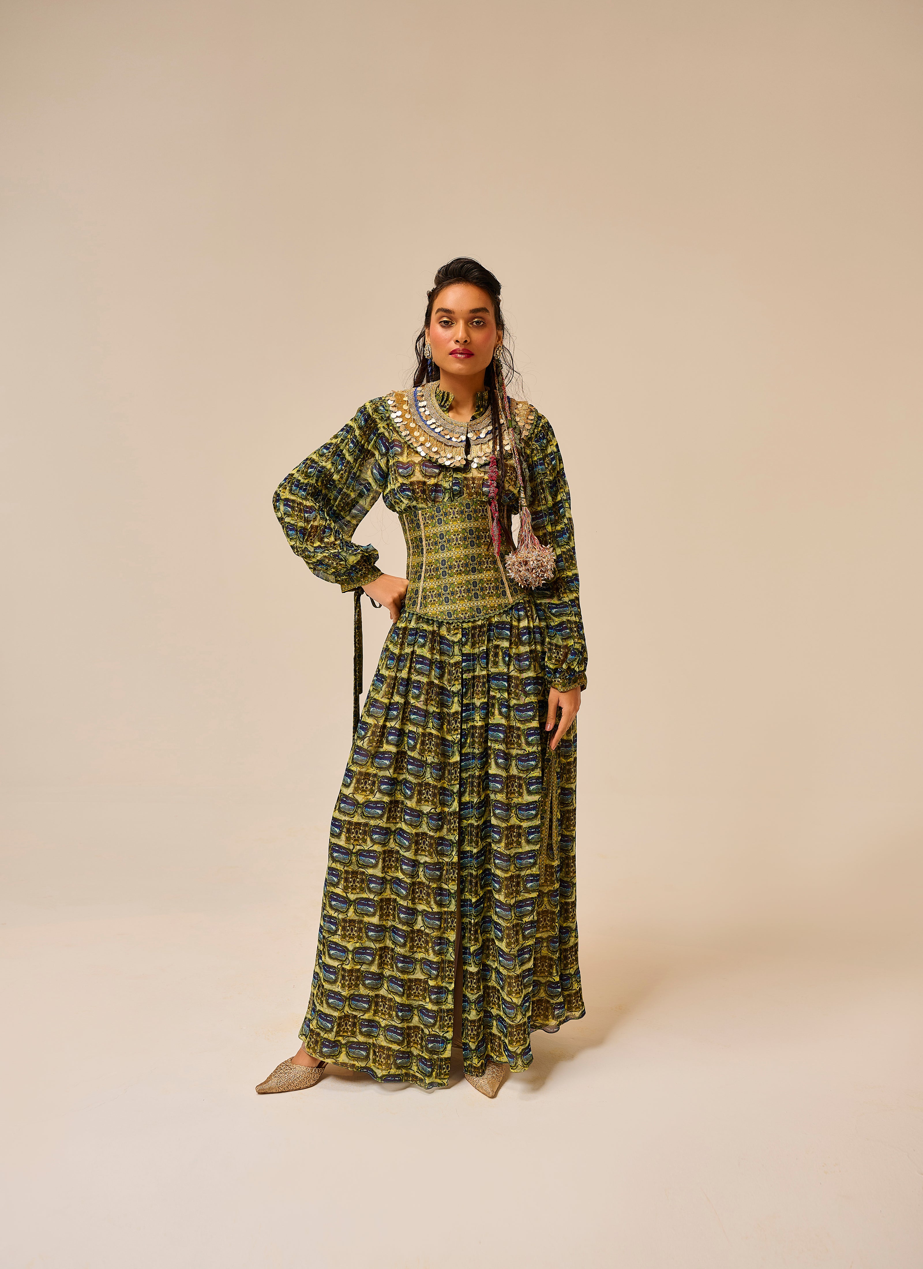 Woman wearing a patterned dress on a beige background