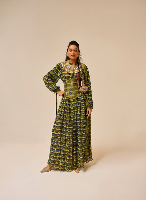 Woman wearing a patterned dress on a beige background