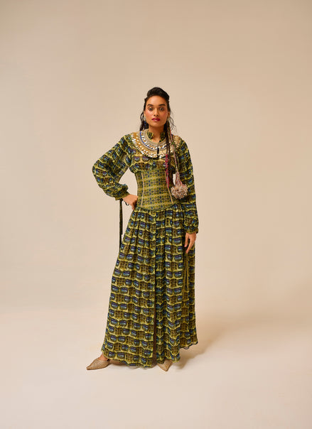 Woman wearing a patterned dress on a beige background