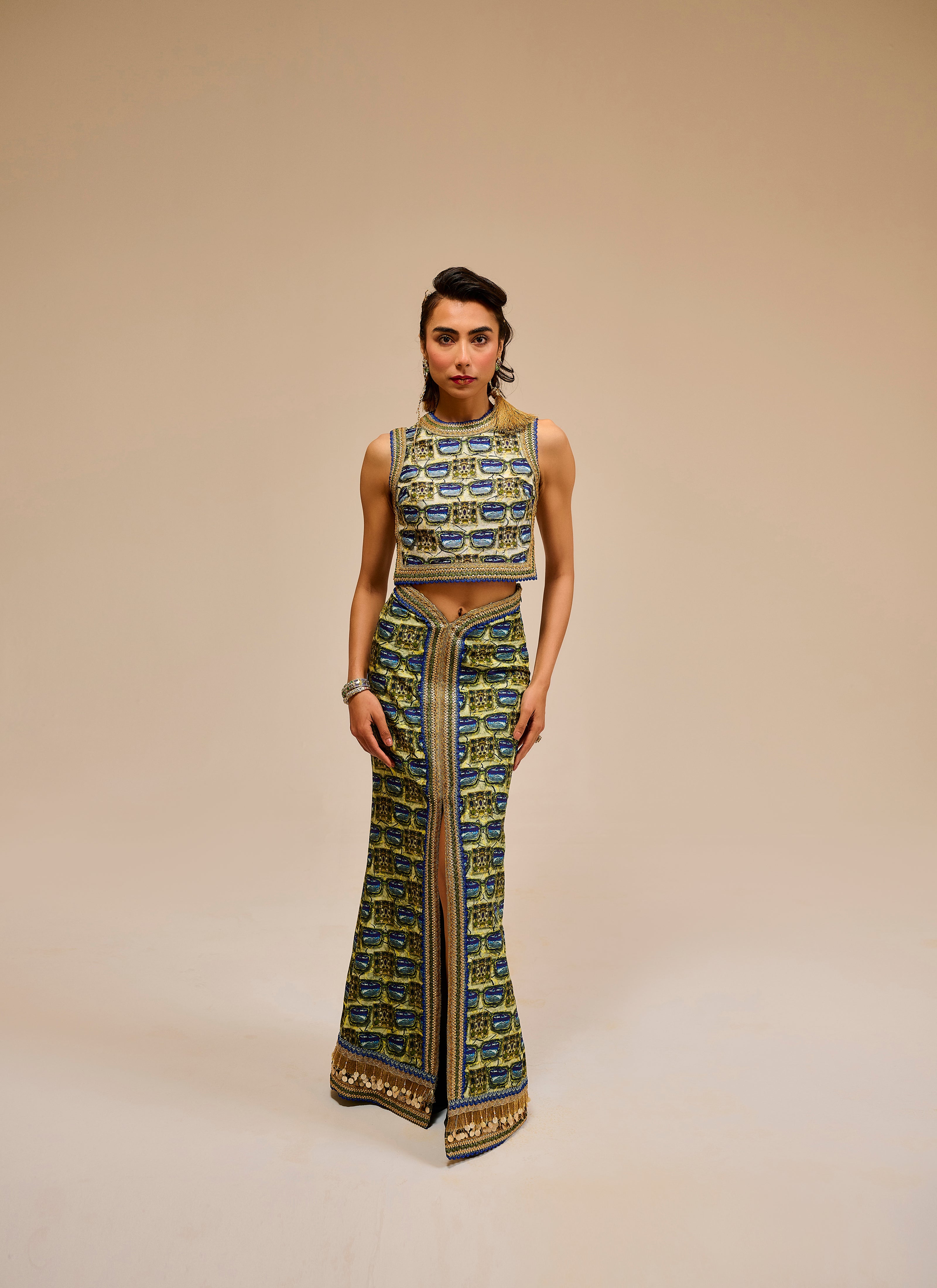 Woman wearing a patterned outfit on a beige background