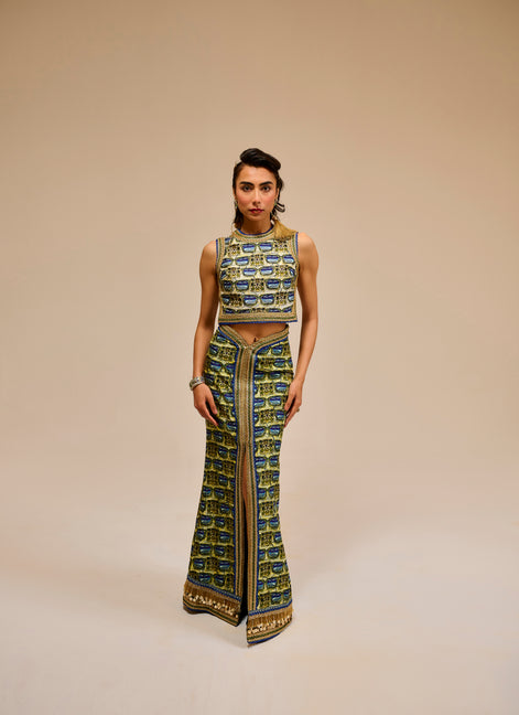 Woman wearing a patterned outfit on a beige background
