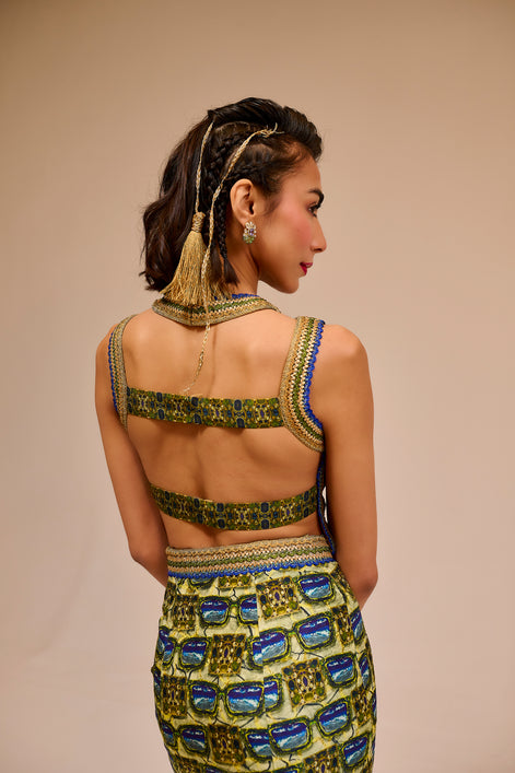 Woman wearing a colorful dress with a patterned design on a beige background