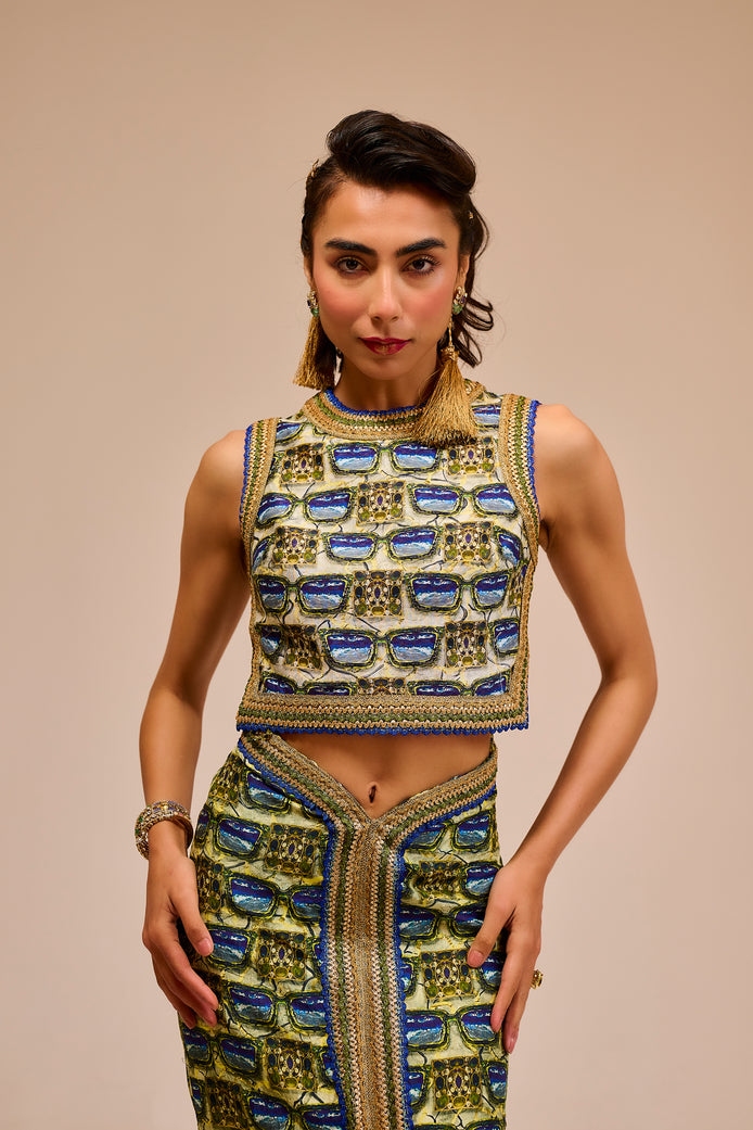 Woman wearing a traditional outfit with intricate patterns on a beige background