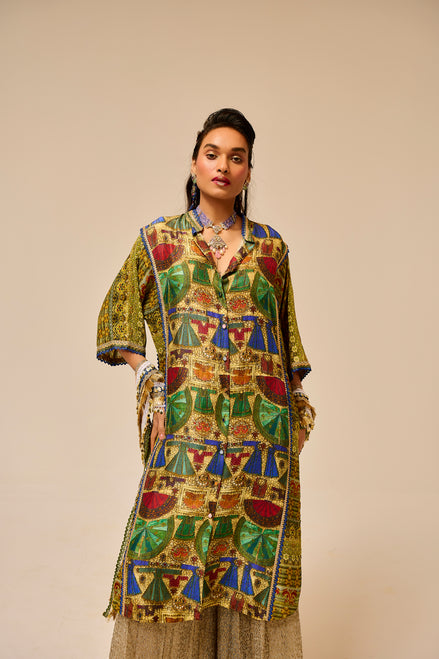 Woman wearing a colorful patterned outfit against a beige background