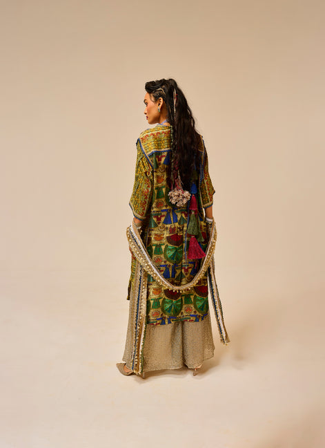 Traditional outfit with intricate patterns on a plain background