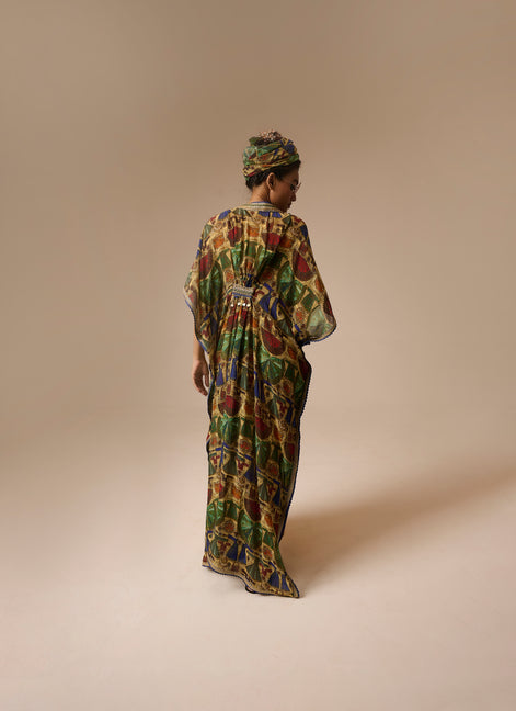 Woman wearing a colorful patterned dress against a beige background
