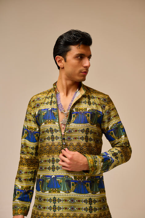 Man wearing a patterned shirt against a beige background
