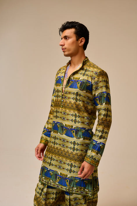 Man wearing a patterned kurta against a beige background