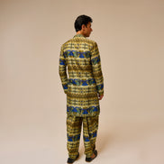 Person wearing a patterned outfit on a beige background