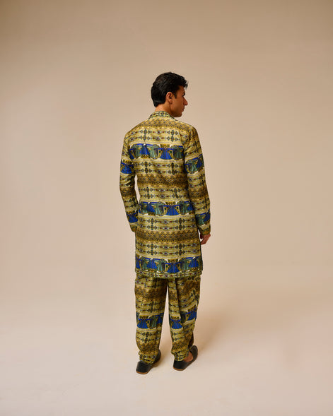 Person wearing a patterned outfit on a beige background