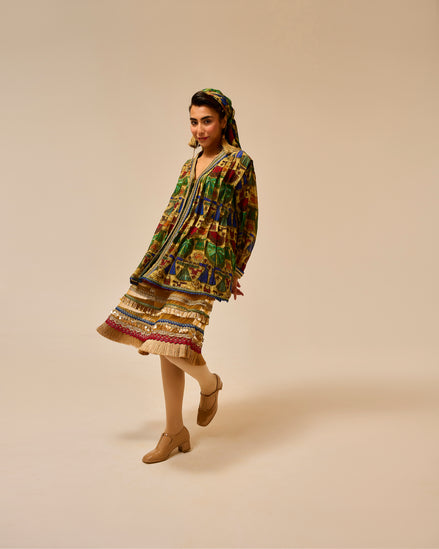 Woman wearing a colorful traditional outfit on a beige background
