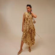 Woman wearing a patterned dress against a beige background