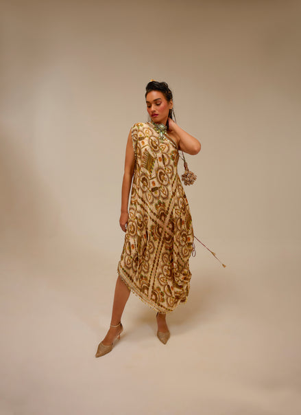 Woman wearing a patterned dress against a beige background