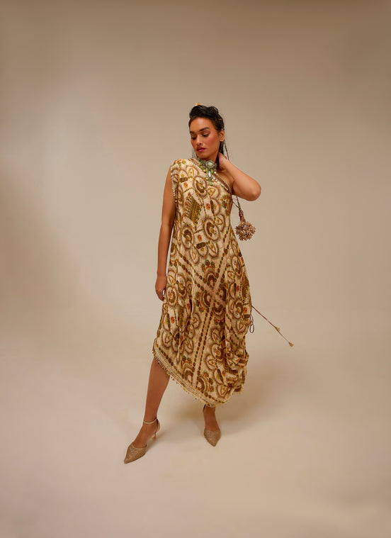 Woman wearing a patterned dress against a beige background