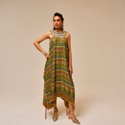 Woman wearing a patterned dress on a beige background