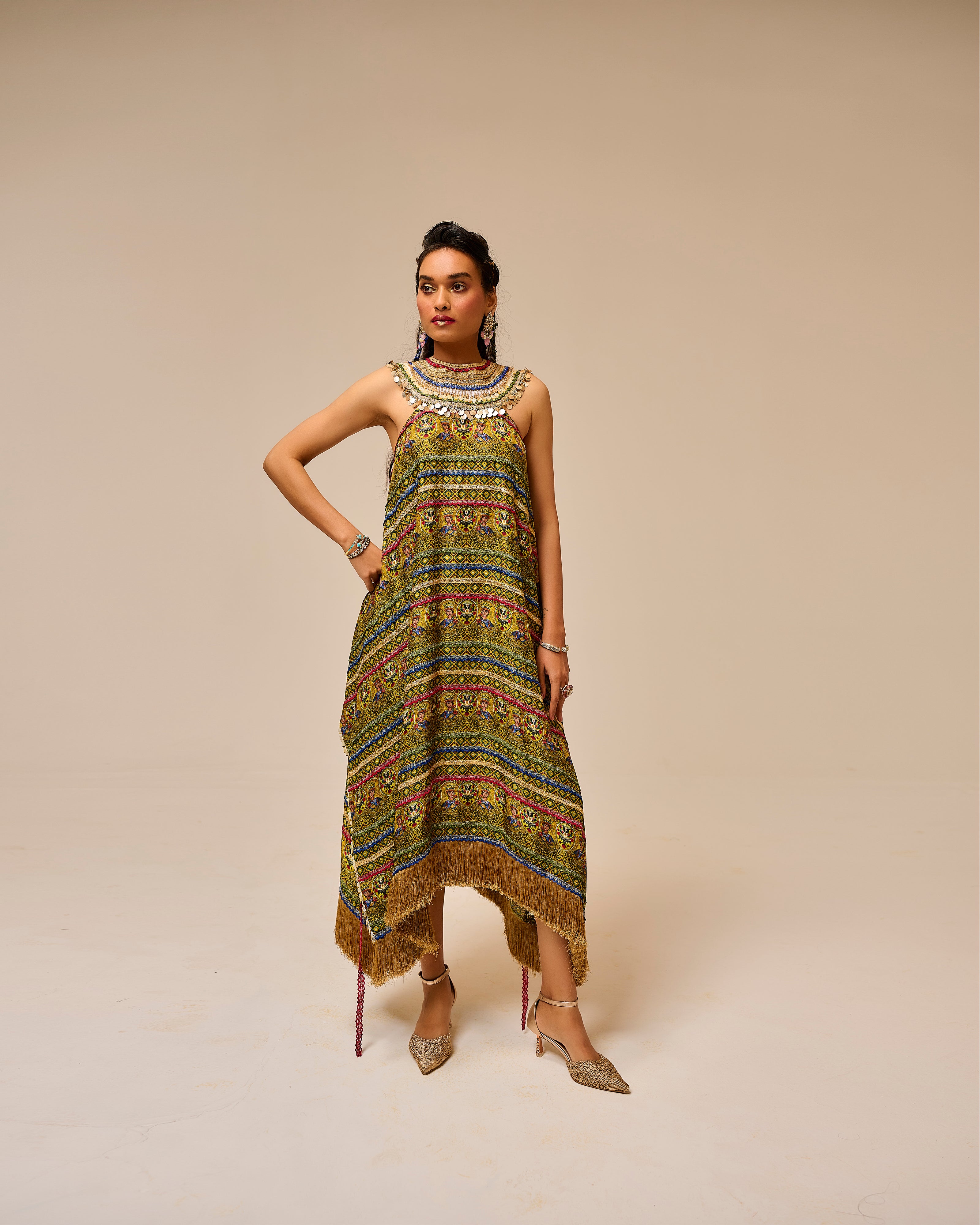 Woman wearing a patterned dress on a beige background
