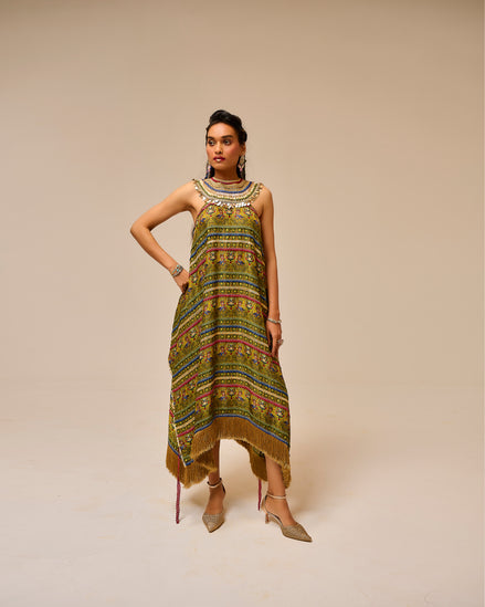 Woman wearing a patterned dress on a beige background