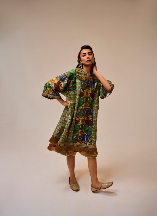 Woman wearing a colorful patterned dress on a beige background