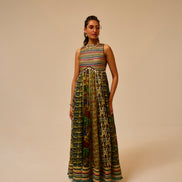 Woman wearing a colorful patterned dress on a beige background