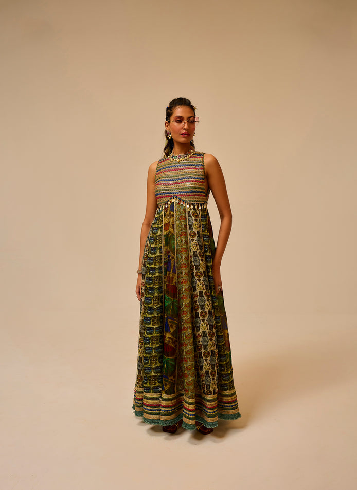 Woman wearing a colorful patterned dress on a beige background
