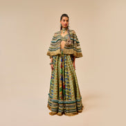 Woman wearing a patterned outfit on a beige background