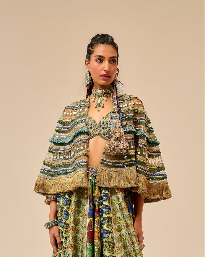Woman wearing a patterned outfit on a beige background
