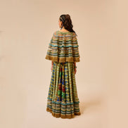 Person wearing a colorful traditional outfit on a beige background