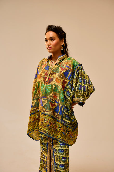 Woman wearing a colorful patterned outfit against a beige background