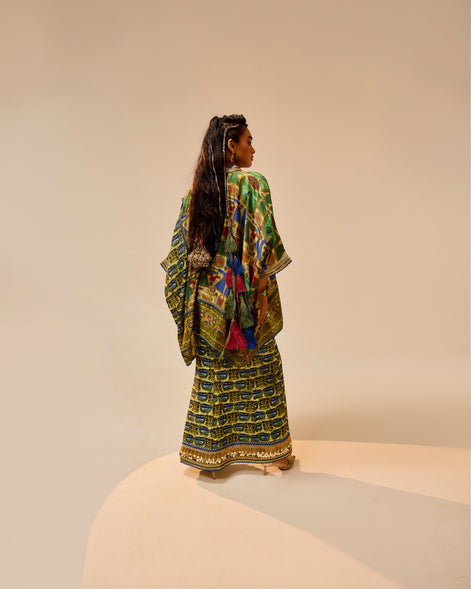 Woman wearing a colorful traditional outfit on a beige background