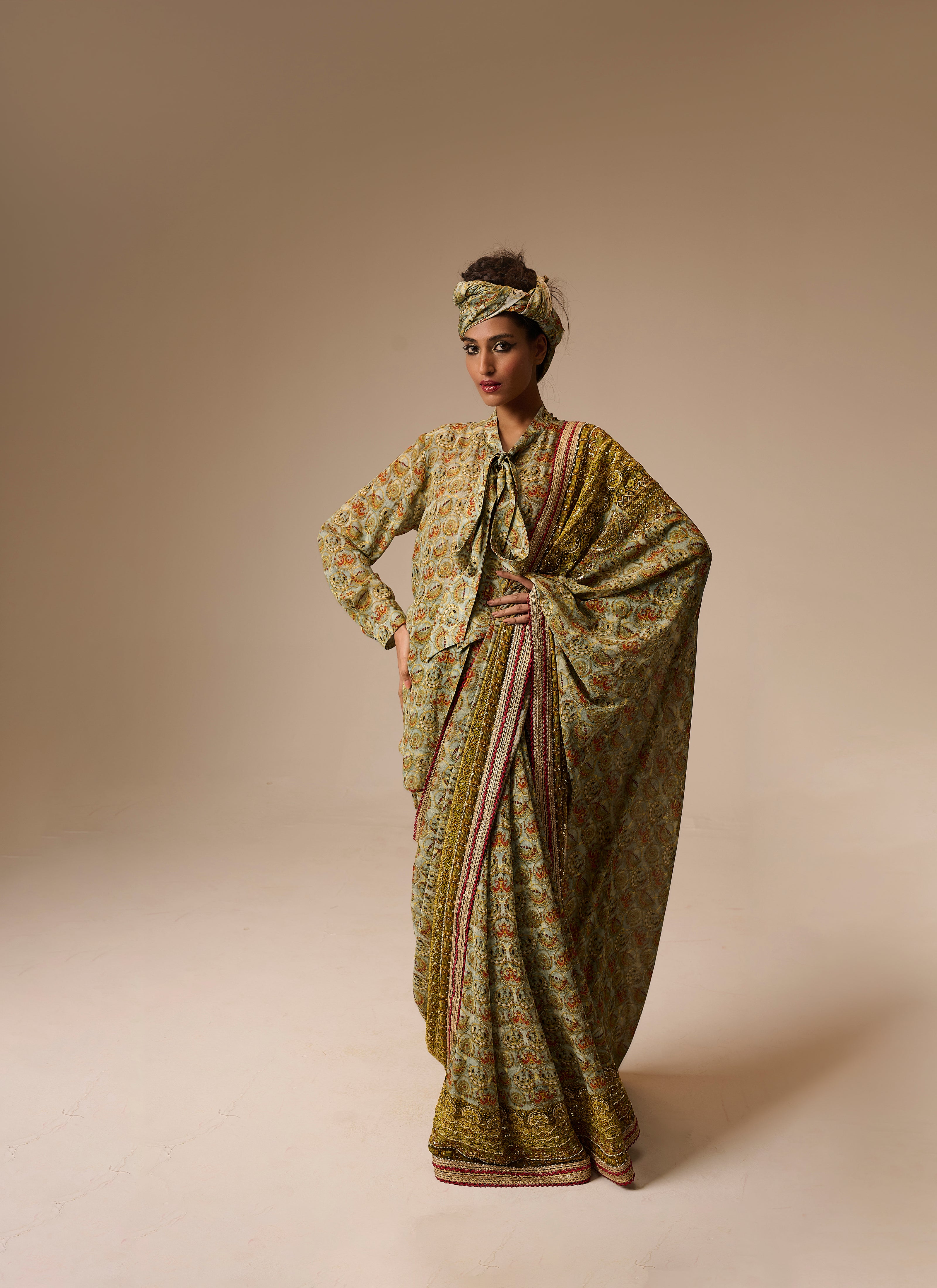 Woman wearing a traditional outfit with a patterned dress and headscarf on a beige background